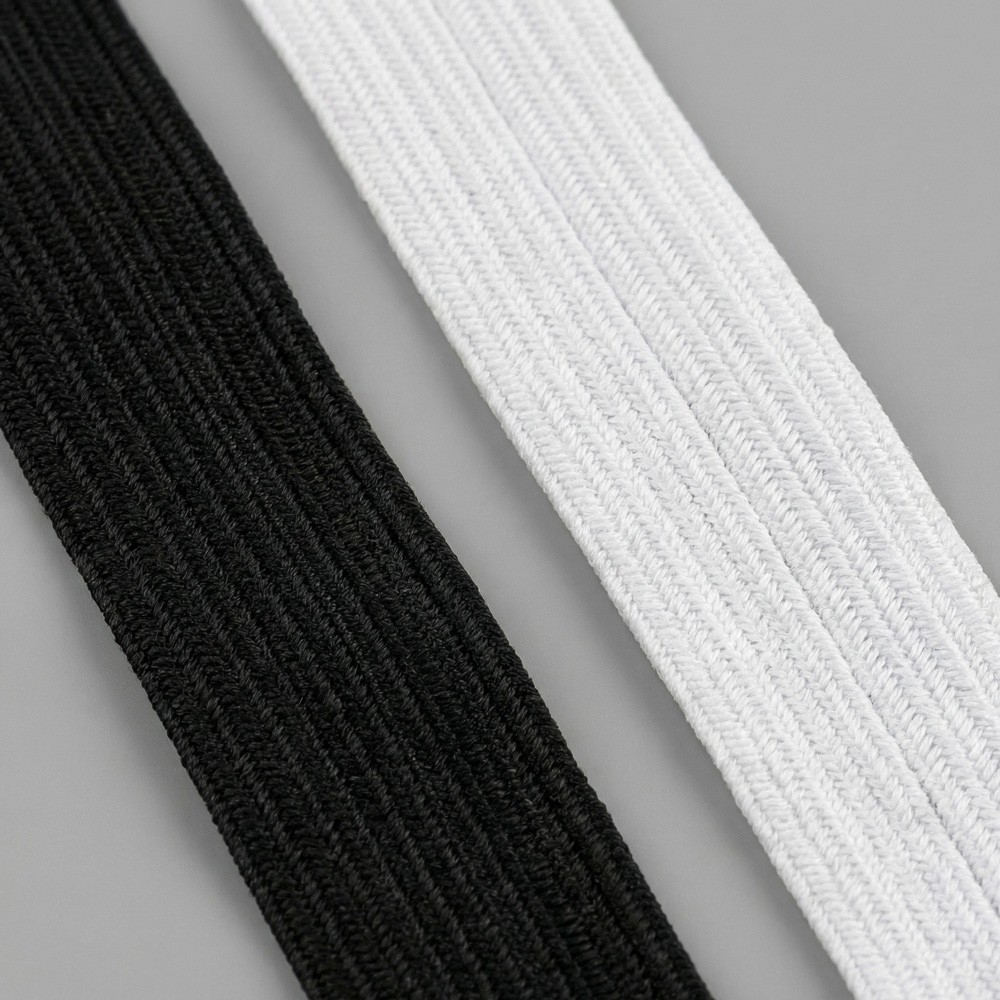 Goma elástica textil en bobina blanco y negro | Suministro textil B2B