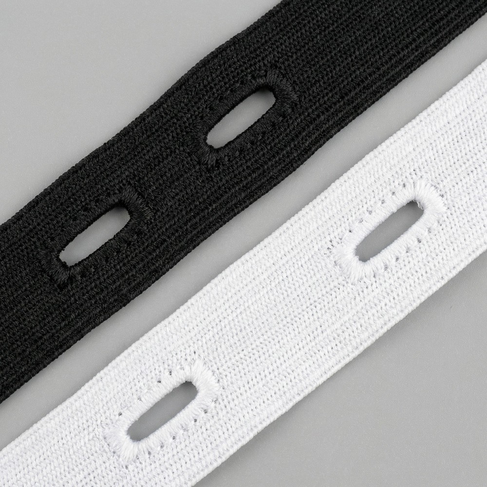 Goma elástica con ojales en bobina | Suministro textil profesional B2B